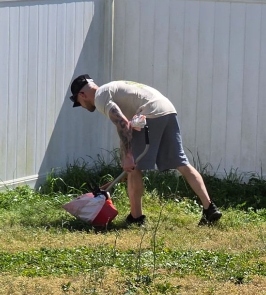 Dilly's Dog Duty owner Dylan thoroughly cleaning a customer yard in Greer SC